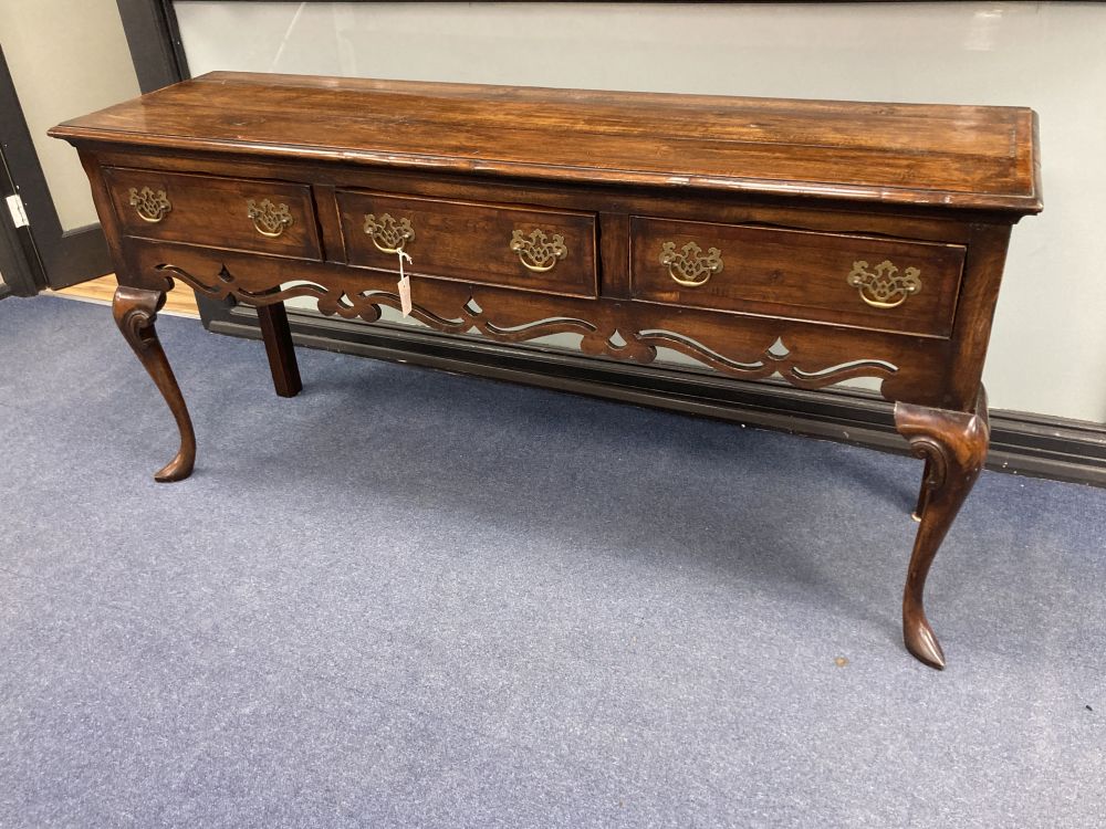 A reproduction mid 18th century oak and mahogany crossbanded dresser, fitted three small drawers, raised on cabriole legs